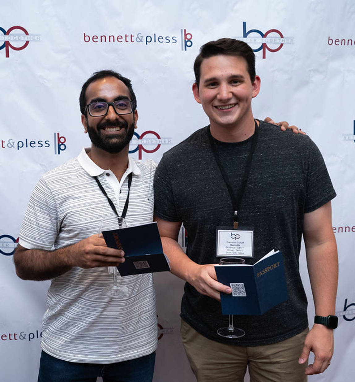 Two guys holding awards at the Bennett & Pless Structural Engineering Firm Conference Photo Op